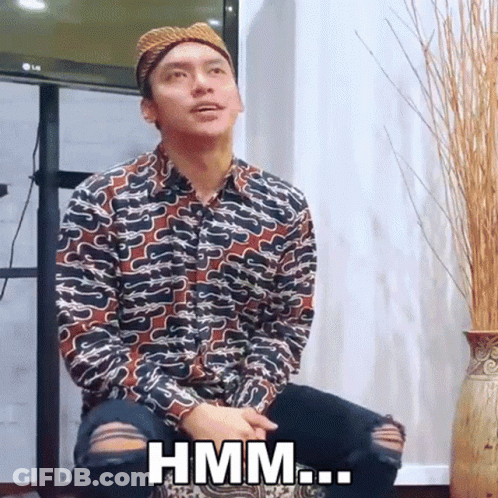 Man In Hat Sitting In Front Of LG TV Says Hmm GIF