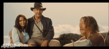 Man In Hat Sitting Next To Woman And Man With Long Hair GIF