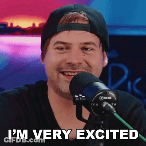 Man In Hat Smiling At Microphone Saying I'm Very Excited GIF