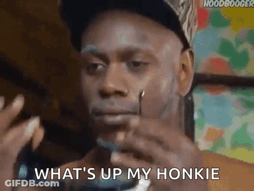 Man In Hat Smoking Cigarette Saying What's Up My Honkie GIF