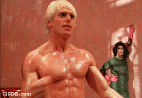 Man In Hat Standing In Doorway Says I Am Your Singing Telegram GIF