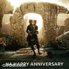 Man In Hat Standing In Front Of Brick Wall GIF