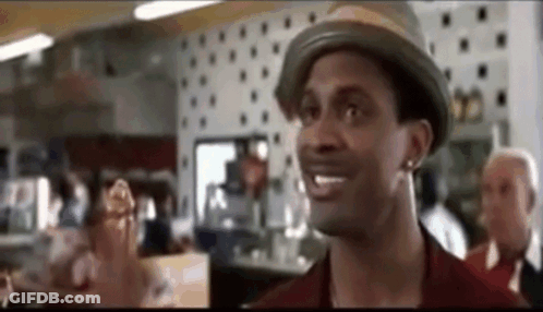 Man In Hat Standing In Restaurant GIF