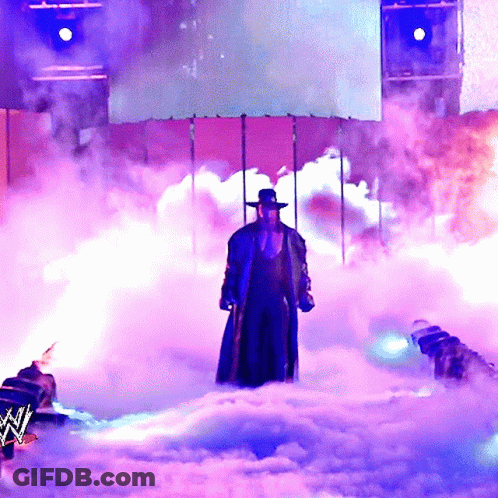 Man In Hat Standing In Smoke GIF