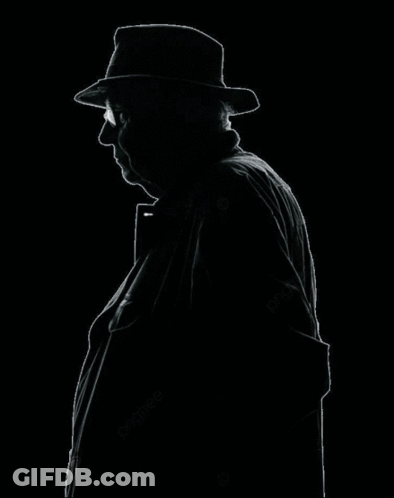 Man In Hat Standing Next To Skeleton GIF