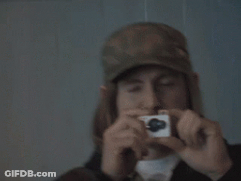 Man In Hat Taking Picture With Camera GIF