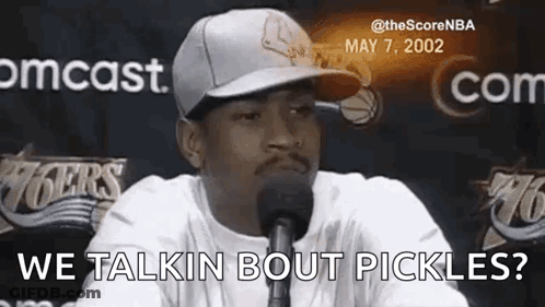 Man In Hat Talking Into Microphone Saying We Talkin Bout Pickles GIF