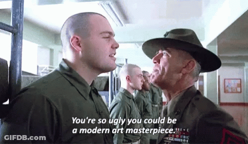 Man In Hat Talking To Man In Military Uniform With Another Man Looking On GIF