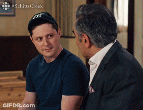 Man In Hat Talking To Man In Suit #Schittscreek GIF