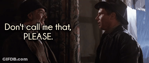 Man In Hat Talks To Another Saying Don't Call Me That Please GIF