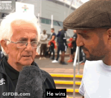 Man In Hat Talks To Older Man Saying He Wins GIF