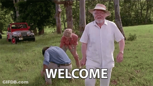 Man In Hat Walking Through Grassy Field Welcome GIF