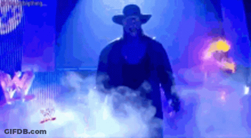 Man In Hat Walking Through Smokey Area With W Logo GIF