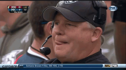 Man In Hat Watching Game On Fox With Microphone GIF