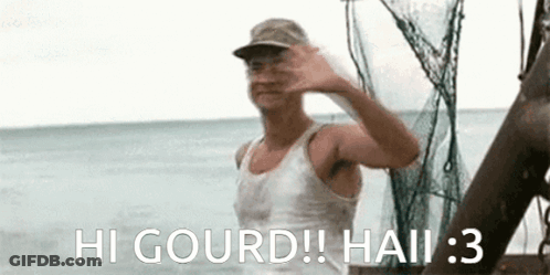 Man In Hat Waving On Boat GIF