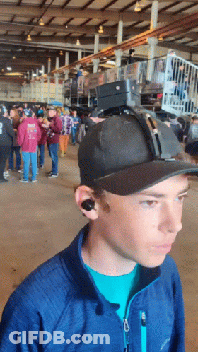 Man In Hat With Camera And Columbia Jacket GIF