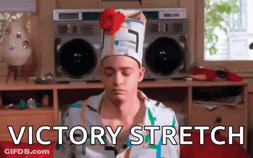 Man In Hat With Flower Sitting In Front Of Boombox Victory Stretch GIF