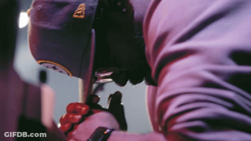 Man In Hat With Letter A Holding Cell Phone GIF