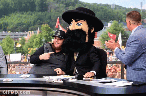 Man In Hat With Letter A Pointing At Mascot GIF