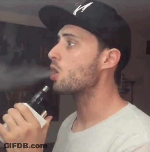 Man In Hat With Letter A Smoking E-Cigarette GIF