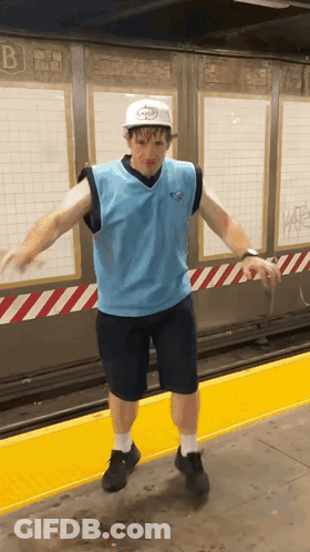 Man In Hat With Letter B On Yellow Platform GIF