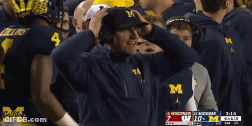 Man In Hat With Letter M Watching Football Game GIF