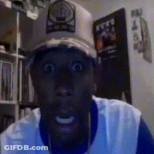 Man In Hat With Letter O Looks Surprised GIF