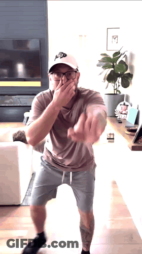 Man In Hat With Letter P Covering Mouth GIF