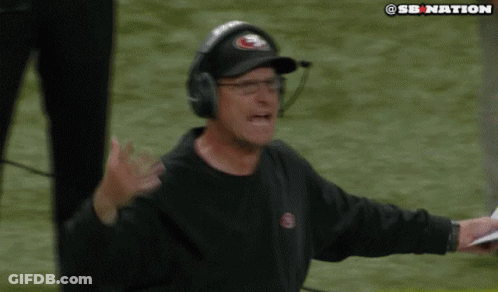 Man In Hat With Letter S On Football Field GIF