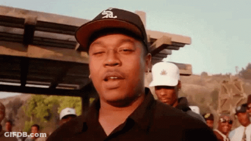 Man In Hat With Letter S Standing Before Crowd GIF