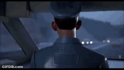 Man In Hat With Letter T Looking At Camera GIF