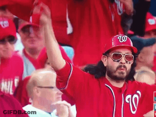 Man In Hat With Letter W In Crowd GIF