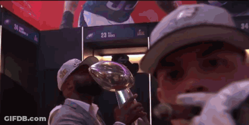 Man In Hat With Number 23 Holding Trophy GIF