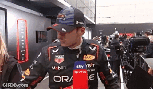 Man In Hat With Ora Sports Shirt GIF