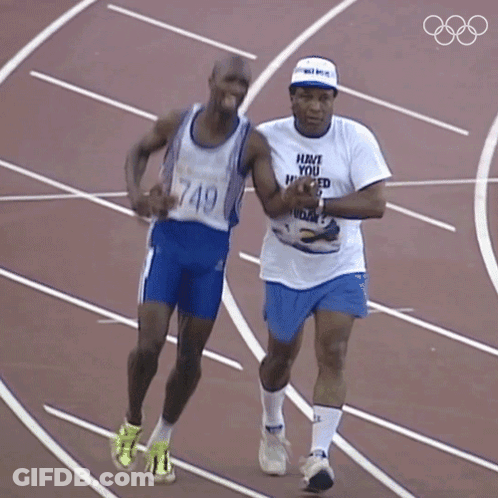 Man In Have You Heard T-Shirt Running With Another Man GIF