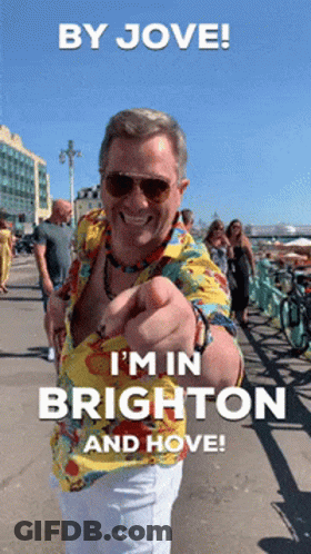 Man In Hawaiian Shirt Pointing At Camera Saying By Jove I'm In Brighton And Hove GIF