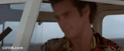 Man In Hawaiian Shirt Sitting In Boat GIF