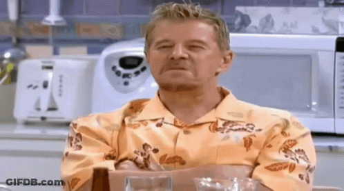 Man In Hawaiian Shirt Sitting With Eyes Closed GIF