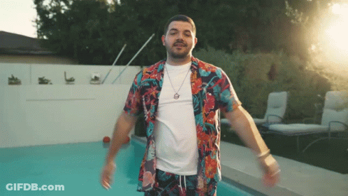 Man In Hawaiian Shirt Standing In Front Of Pool GIF