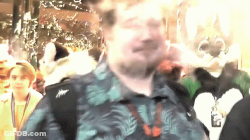 Man In Hawaiian Shirt With Name Tag Saying A GIF