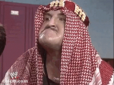 Man In Head Scarf And Keffiyeh Making A Face GIF