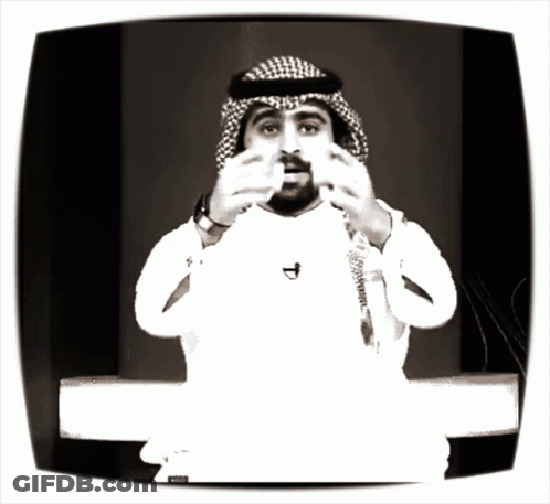 Man In Head Scarf With D Necklace GIF