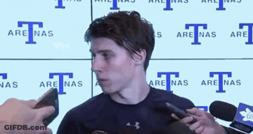 Man In Headband And Black Shirt Talking Into Microphone GIF