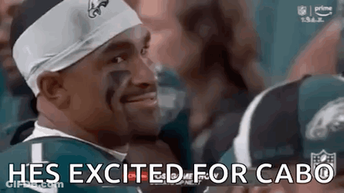 Man In Headband And Football Jersey Smiling GIF