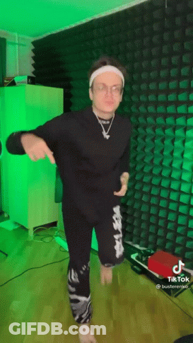 Man In Headband And Glasses Dancing In Green Lights GIF