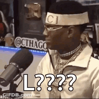 Man In Headband And Glasses Talking Into Microphone GIF