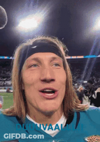 Man In Headband And Jaguars Jersey Looking At Camera GIF