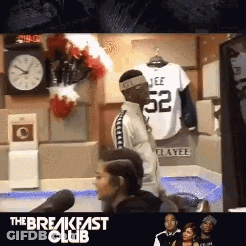 Man In Headband And Jersey Number 52 GIF