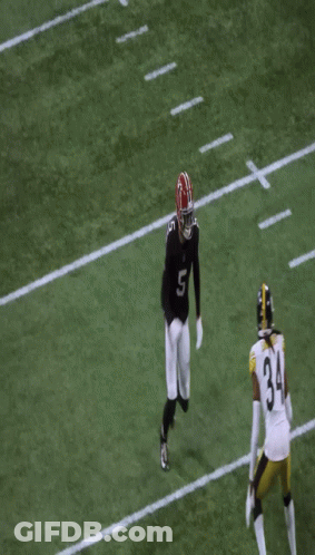 Man In Headband And Jersey Smiling At Game GIF