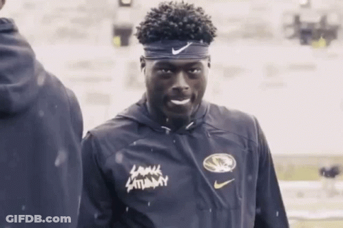 Man In Headband And Lamar Saturday Jacket GIF